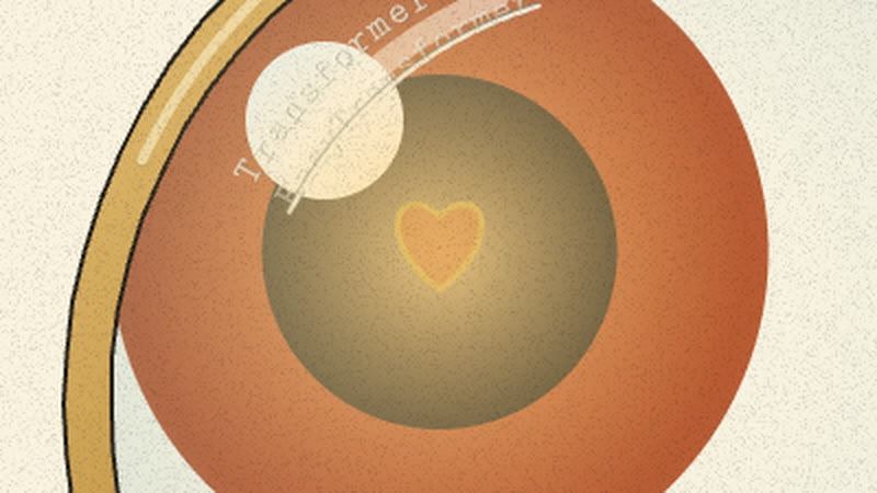 A small warm heart glowing in the creature's pupil under the lens