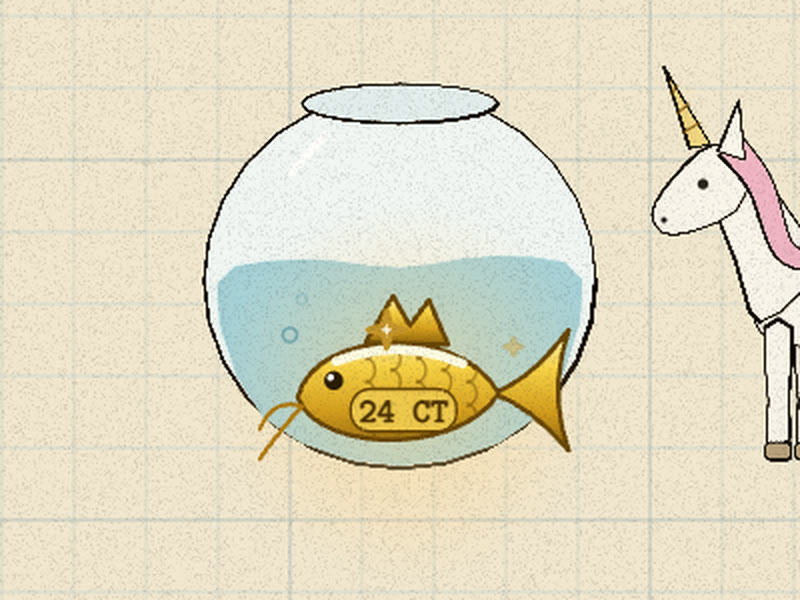A solid gold carp stamped 24 CT resting in a fishbowl