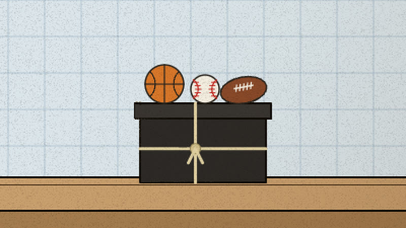 A black box tied with string, basketball, baseball and football on its lid
