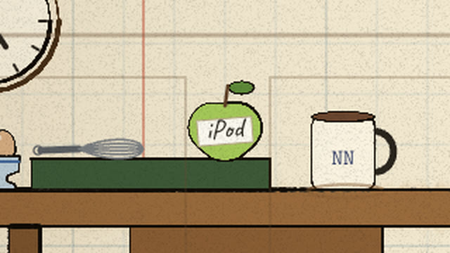 A green apple with a handwritten iPod label on her notebook